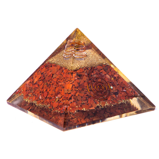 Pyramid-shaped object with spiral designs on a white background