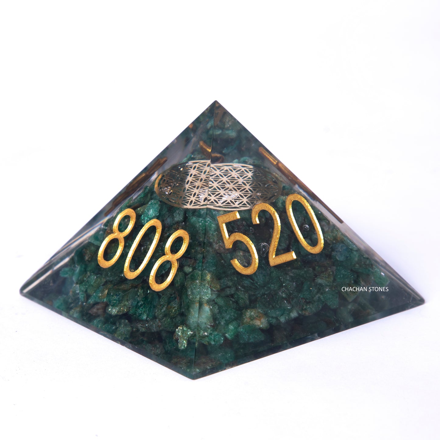 Pyramid-shaped green stone with gold numbers '808 520' on a white background