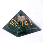 Pyramid-shaped stone with gold numbers '520741' on a white background