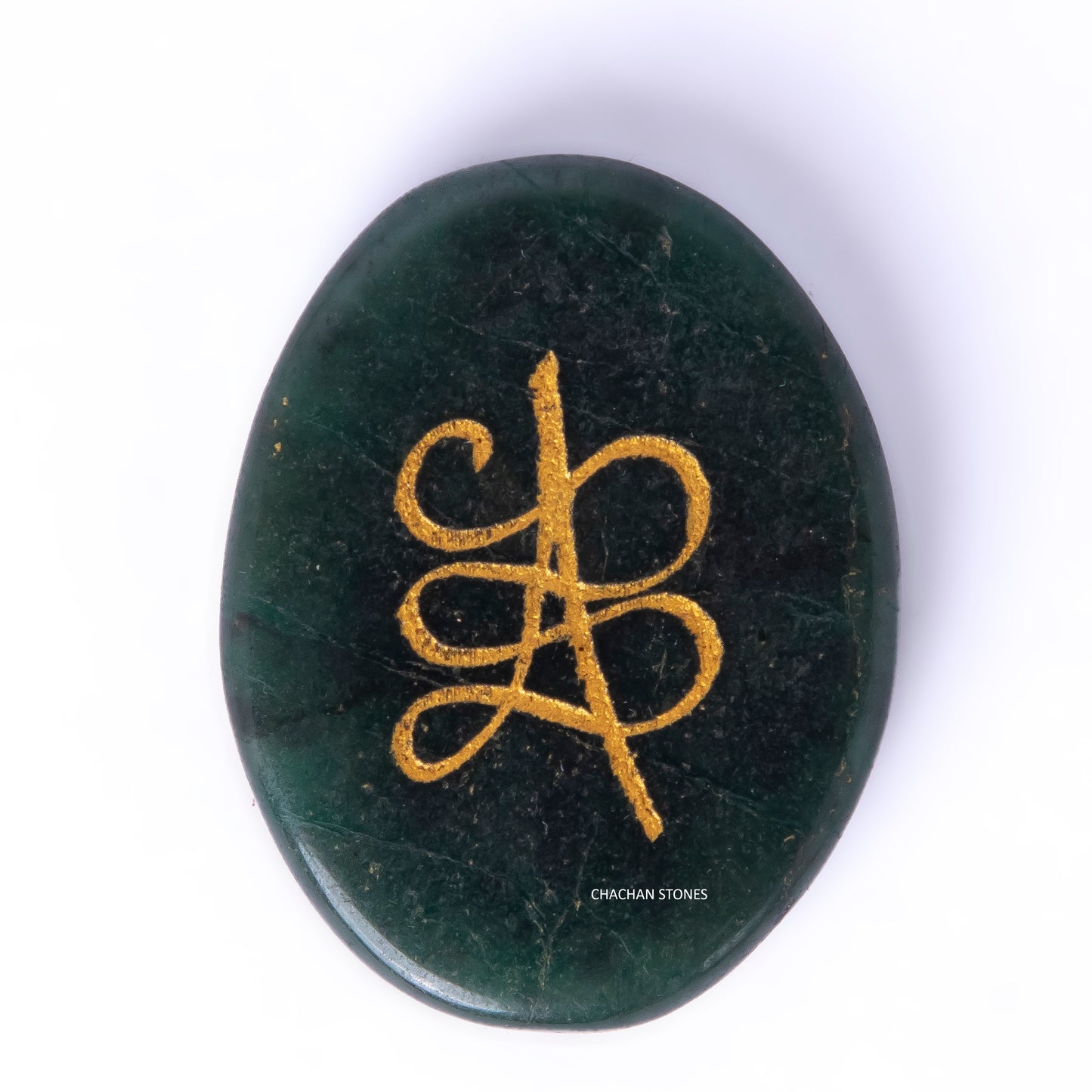 Green stone with gold symbol on a white background