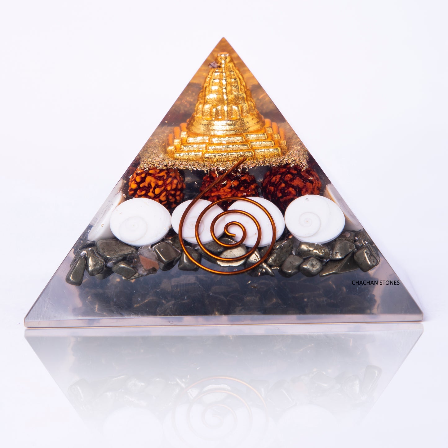 Triangular pyramid with decorative elements on a white background