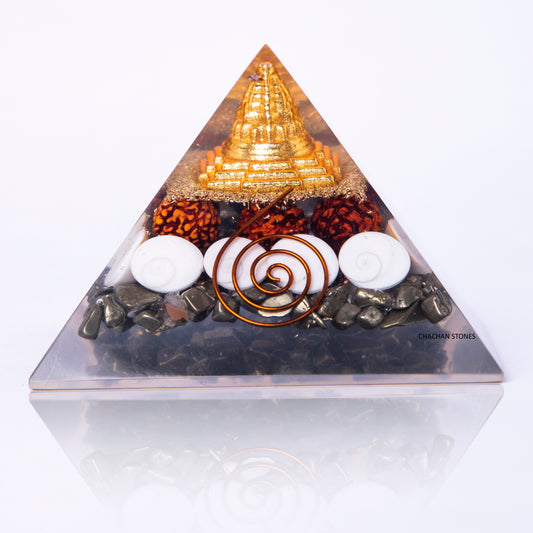 Triangular pyramid with decorative elements on a white background