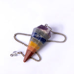 Colorful crystal pendulum on a white background