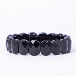 Black beaded bracelet on a white background