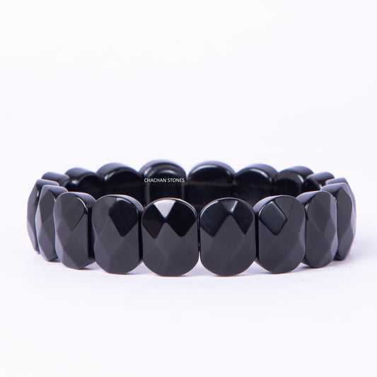 Black beaded bracelet on a white background
