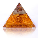 Triangular crystal pyramid with spiral design on a white background
