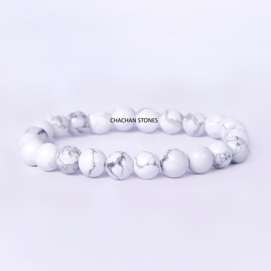 White beaded bracelet with 'Chachan Stones' branding on a light gray background