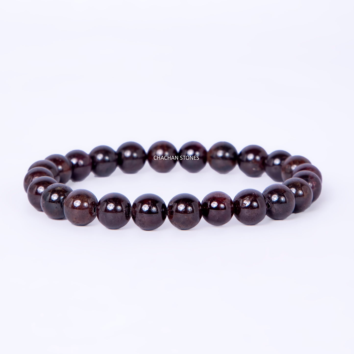 Dark brown beaded bracelet on a white background