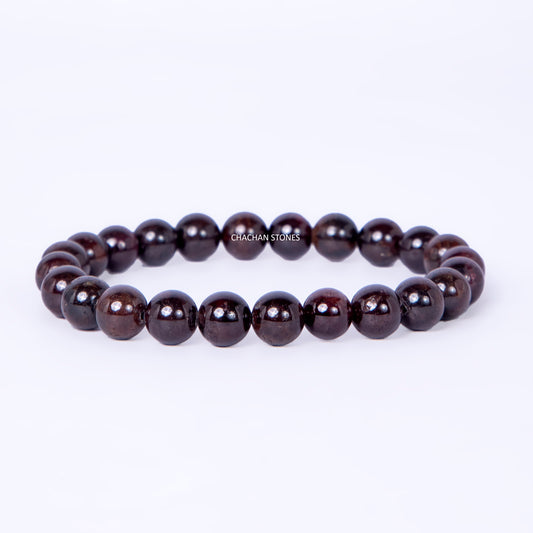 Dark brown beaded bracelet on a white background