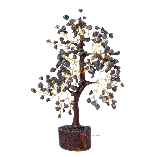 Decorative tree with stone-like leaves on a white background